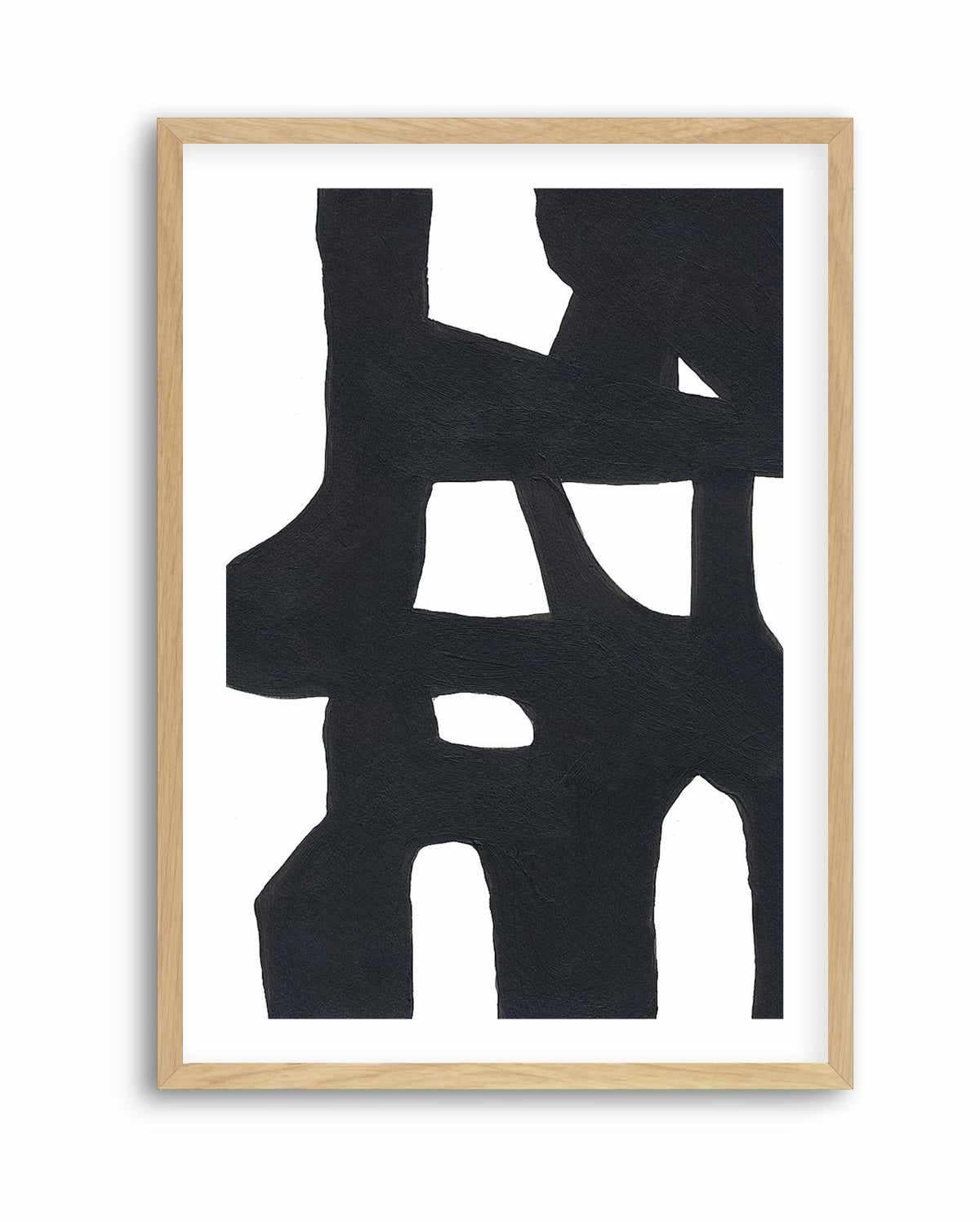 Black and white bold abstract print with interlocking shapes, in a natural wood frame with white border