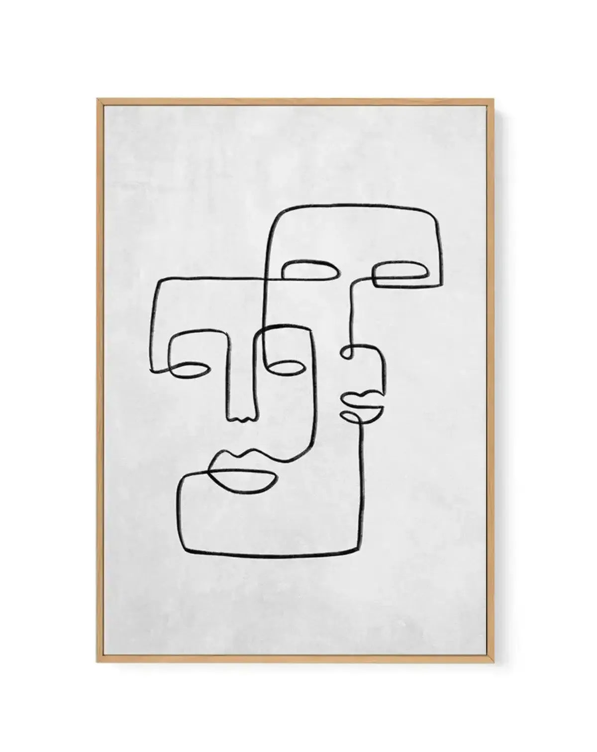 Framed canvas art print featuring two abstract line-drawn faces in black ink on a light gray concrete textured background. The faces are created with continuous, minimalist linework depicting simplified facial features including eyes, noses, lips, and ear outlines. The design has an artistic, sketch-like quality. The artwork is displayed in a natural wood frame with a white border.