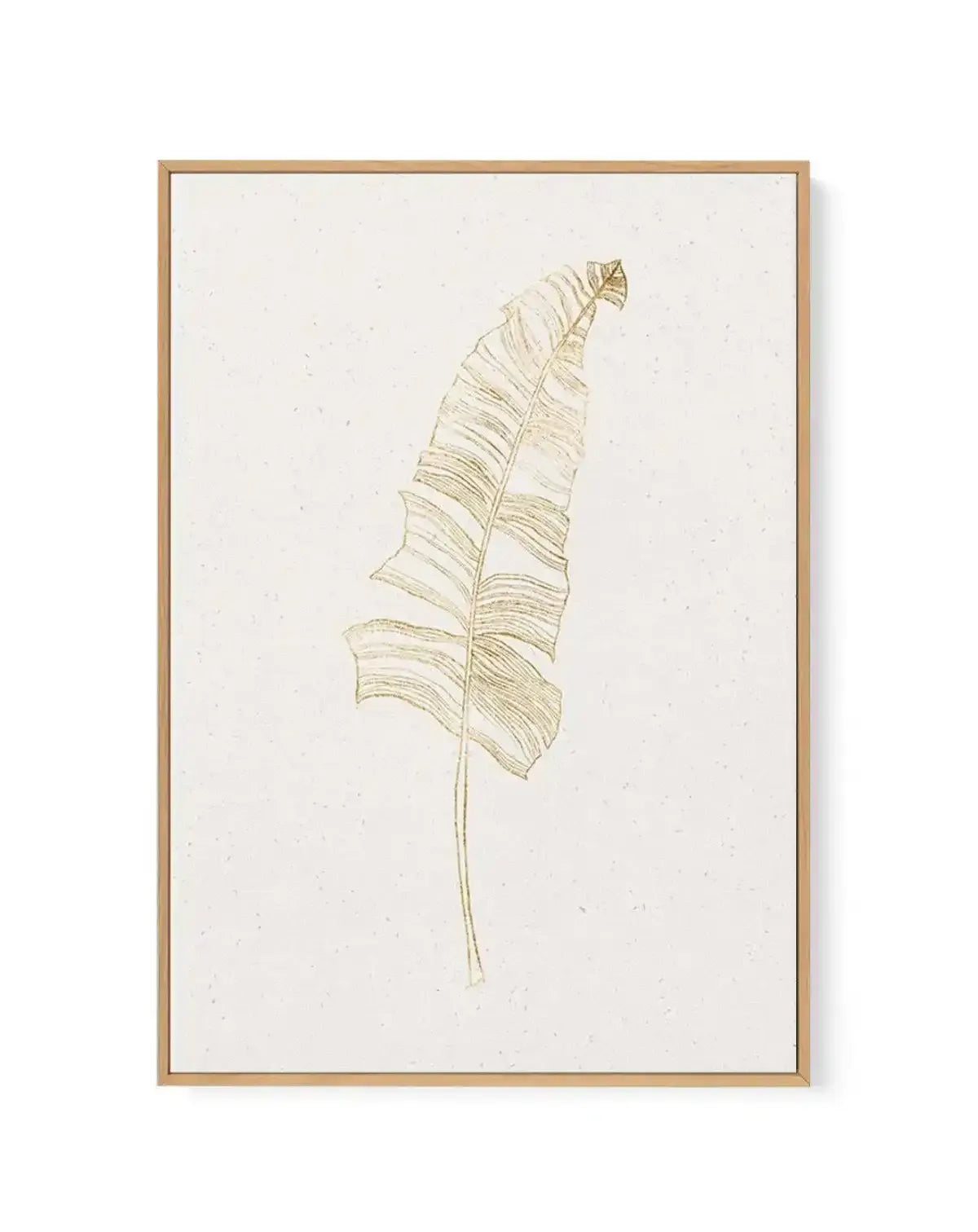 Framed canvas art print featuring a minimalist botanical illustration of a single palm leaf in soft gold and tan tones against a cream background. The leaf is rendered with fine linear details showing the characteristic parallel veins and segments of a tropical palm frond, oriented vertically and slightly curved. The artwork is displayed in a natural wood frame with a white border, mounted on a textured off-white canvas.