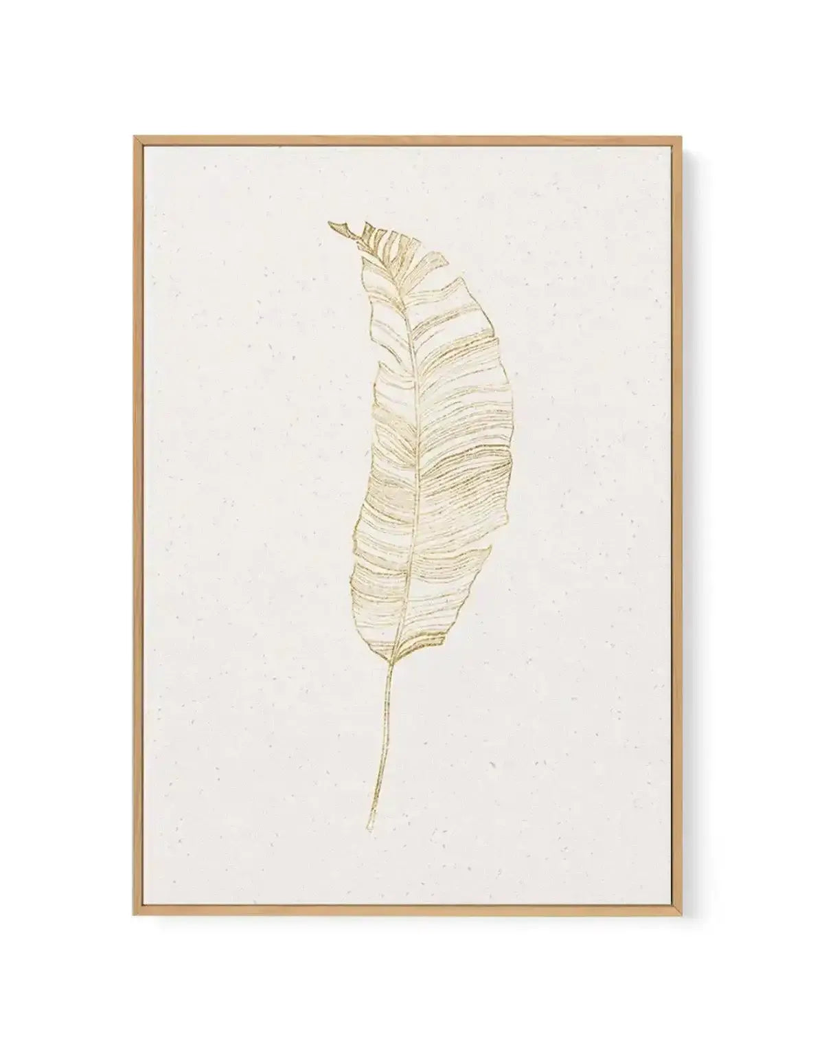 Gold Palm II framed canvas art print featuring a minimalist line drawing of a single palm leaf in muted gold tones on a cream background. The leaf is rendered with fine, delicate linework showing detailed vein patterns and natural curves. The artwork is displayed in a natural wood frame with a white border, mounted against a plain white background.