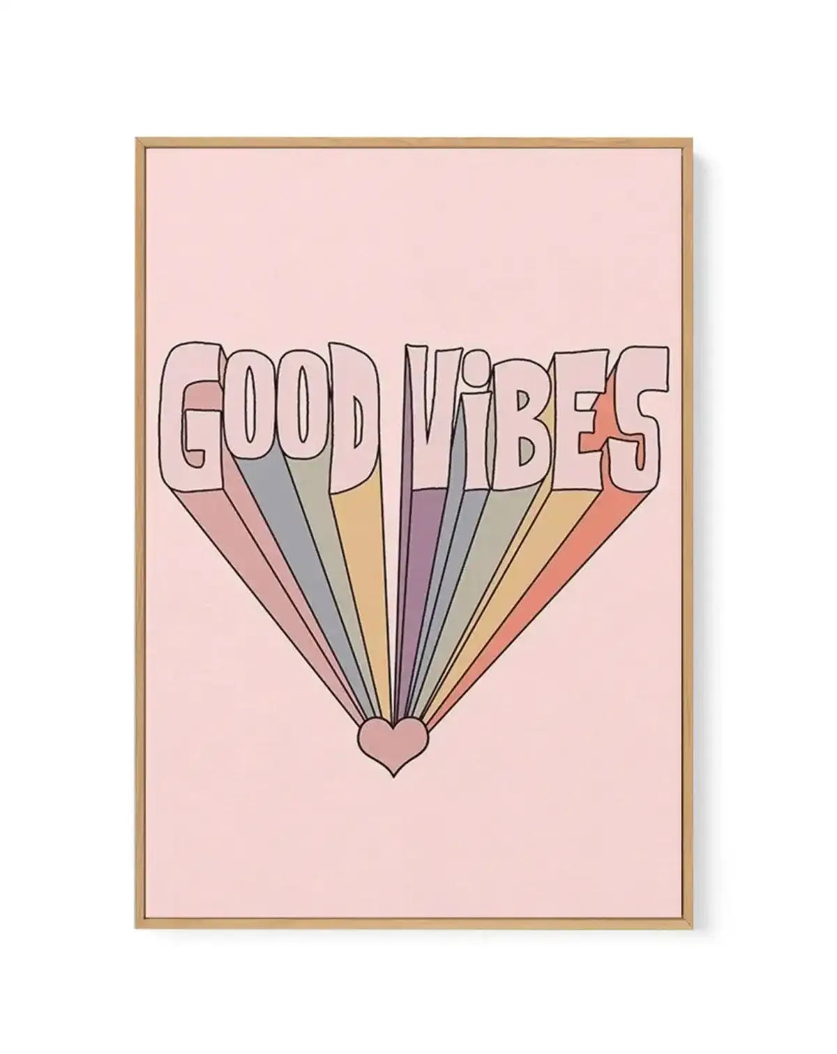 Framed canvas art print featuring the word "Good Vibes" in large outlined letters against a soft pink background. Colorful rays in muted tones of dusty rose, sage green, taupe, mauve, cream, and coral extend downward from a small heart shape at the center bottom, creating a retro-style sunburst effect. The artwork is displayed in a natural wood frame with a white border.