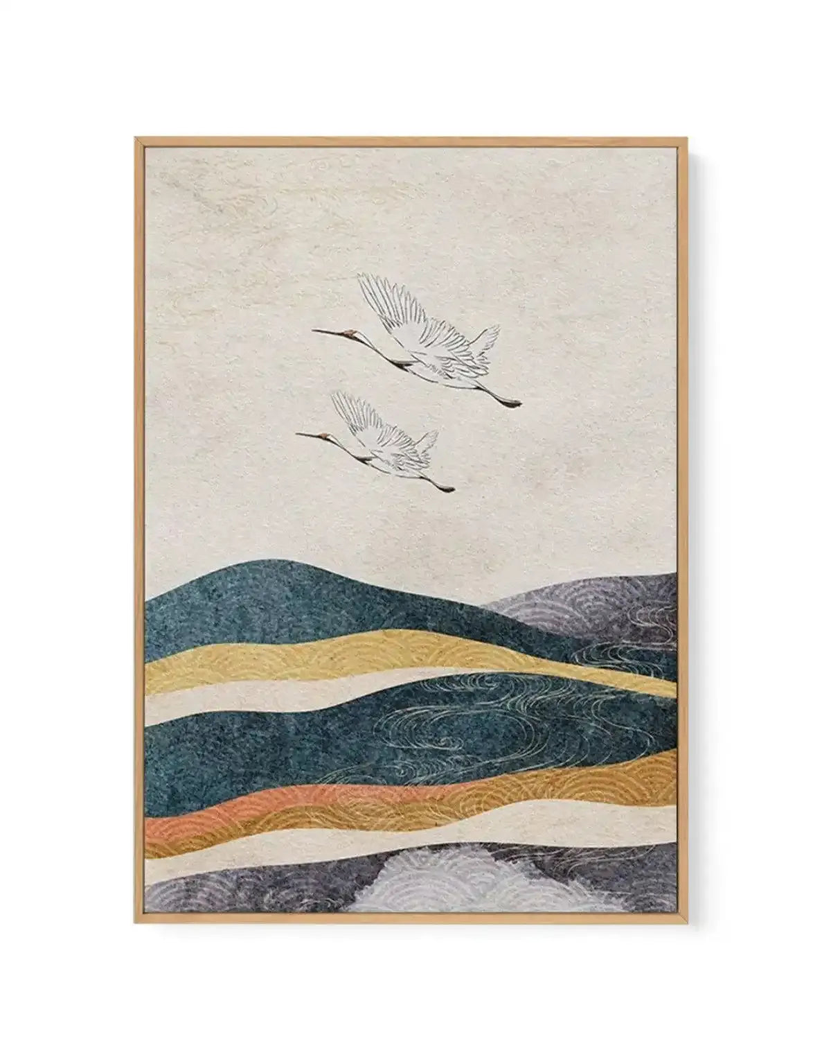 Gallery-wrapped canvas print featuring a Japanese-inspired landscape with two flying cranes against a textured cream sky, displayed in a natural wood frame. The lower half of the composition shows undulating hills or waves in layered bands of deep teal, golden yellow, dark grey, peach, and light grey, with subtle swirling patterns suggesting water or wind.