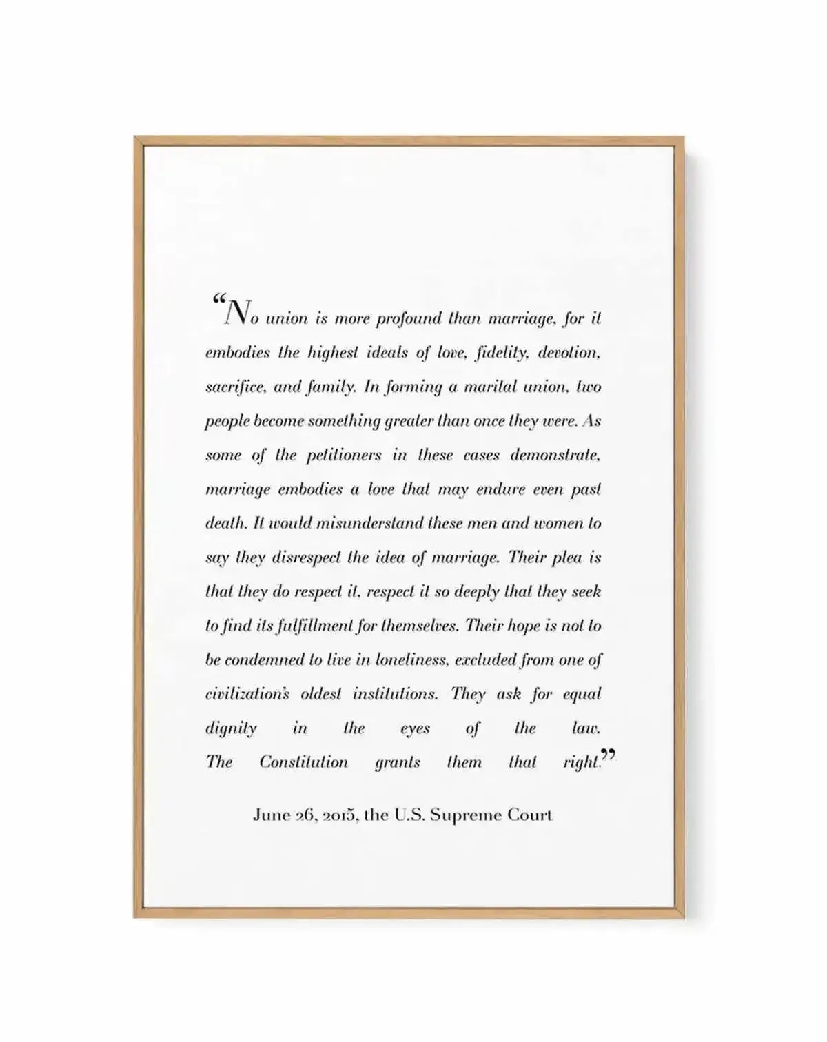 Framed canvas art print with natural wood border featuring an excerpt from the June 26, 2015 U.S. Supreme Court marriage equality decision. The text is printed in black italic serif font on a white background, beginning with "No union is more profound than marriage..." and ending with "The Constitution grants them that right." The wood frame has a warm tan finish with visible grain texture and a subtle shadow effect along the right and bottom edges.