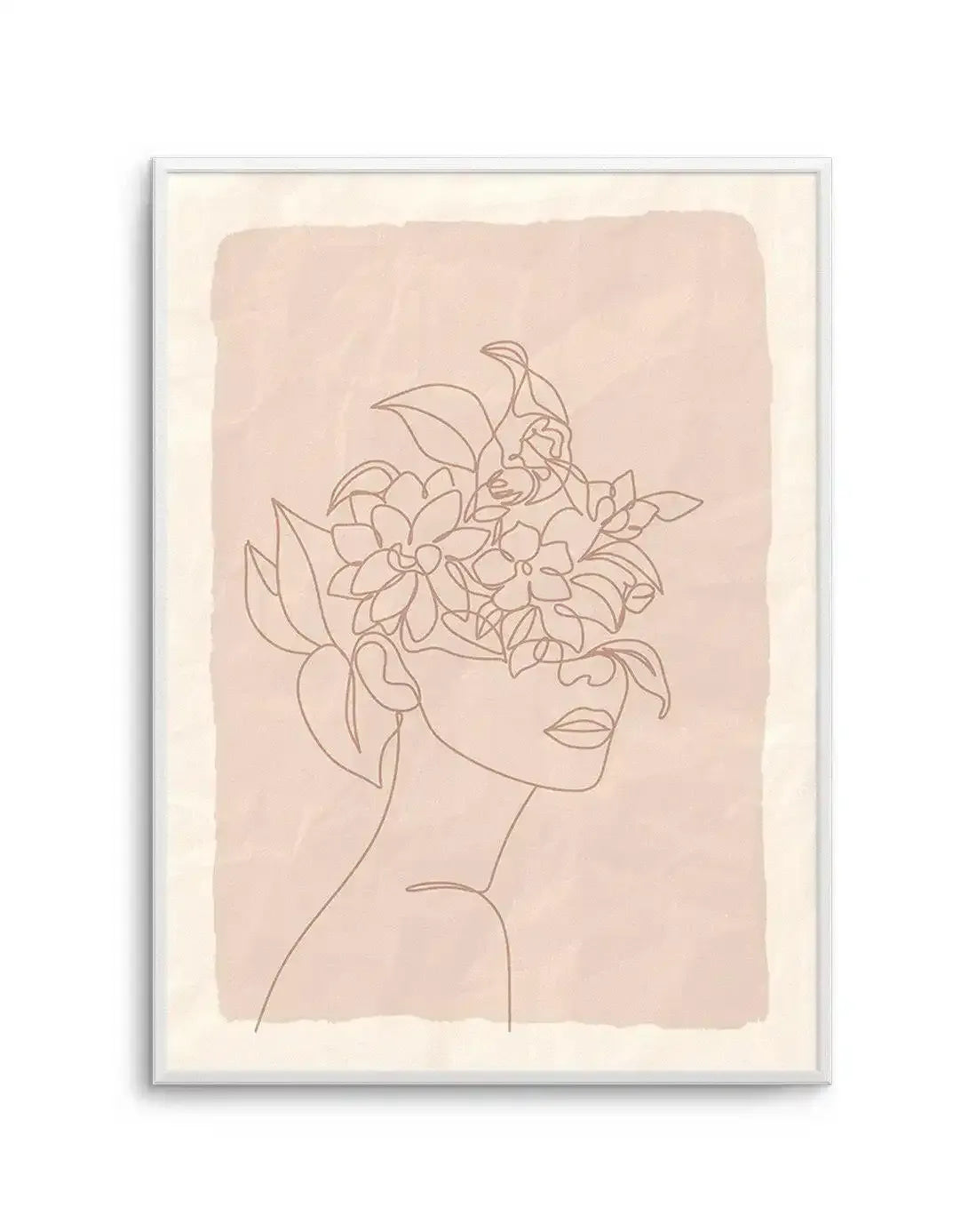 Line art print featuring a woman's profile with her face obscured by a bouquet of flowers and leaves, drawn in a single continuous line in a warm brown tone on a textured blush pink background with a cream border, displayed in a white frame.