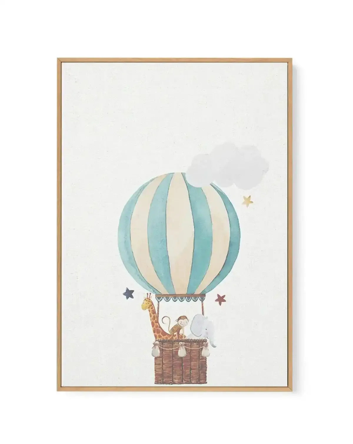 Framed canvas art print featuring a whimsical watercolor illustration of a hot air balloon with vertical stripes in soft teal and cream, suspended above a woven basket. Inside the basket sits a giraffe, monkey, and elephant among clouds and scattered stars in navy, burgundy, and gold. The artwork has a gentle, storybook quality with soft watercolor textures rendered in muted, pastel tones. Natural wood frame with white border around the cream-colored linen canvas.