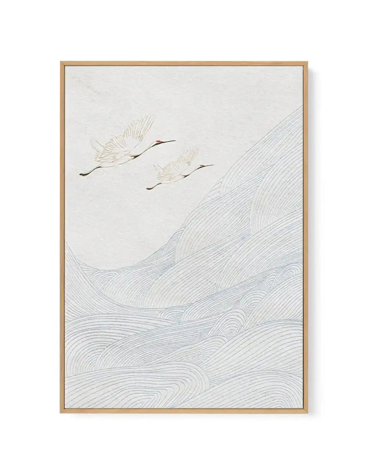 Canvas art print featuring two white cranes with red heads flying over a landscape of rolling hills depicted with light blue wavy lines, all on a textured white background, displayed in a natural wood frame.