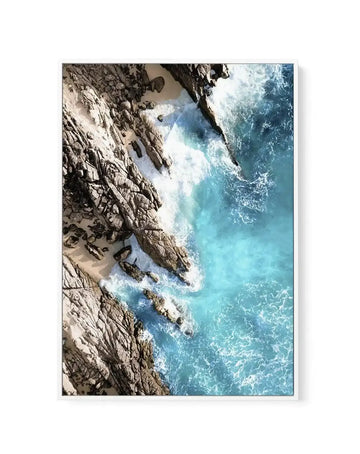 Aerial view of turquoise waves crashing over rocky coastline, canvas in white float frame