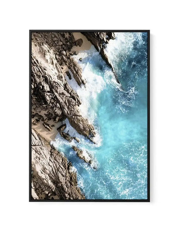 Aerial view of turquoise waves crashing over rocky coastline, canvas in black float frame