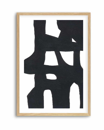 Black and white bold abstract print with interlocking shapes, in a natural wood frame with white border