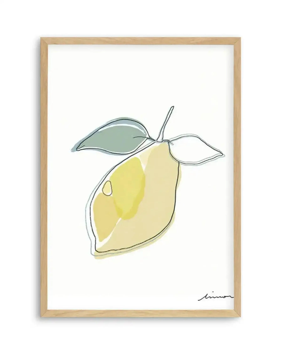 Abstract art print featuring a single lemon with two leaves, outlined in a thin black line with soft yellow and green watercolour washes, displayed in a natural oak frame with white border.