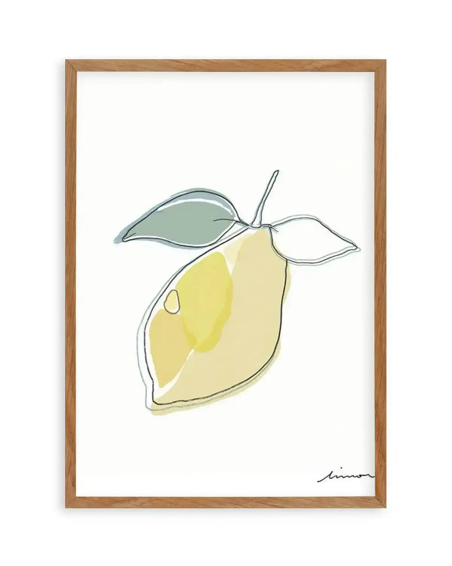 Abstract art print featuring a minimalist line drawing of a lemon with two leaves, filled with soft washes of pale yellow, chartreuse, and muted sage green, printed on fine art paper and displayed in a natural oak frame with white border.