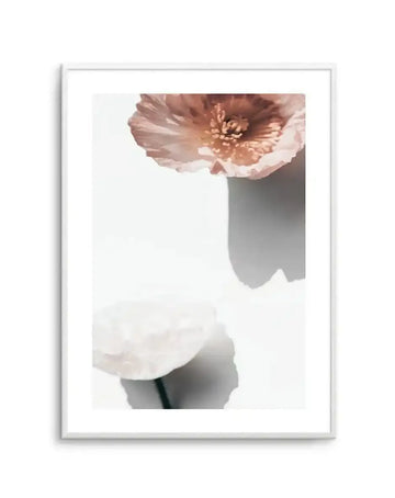 Abstract Poppies IV art print in silver frame with white border, featuring two delicate poppy flowers in soft dusty rose and cream tones against a light neutral background with subtle gray shadowing, creating a minimalist botanical composition with soft-focus watercolor-like qualities.