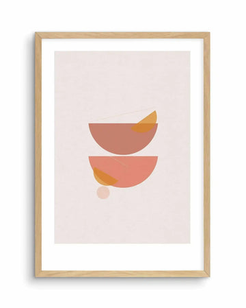 Abstract art print featuring two large semi-circular shapes, one sienna and one peach, with smaller overlapping semi-circles and thin lines in shades of orange and yellow, printed on fine art paper and displayed in a natural oak frame with white border.