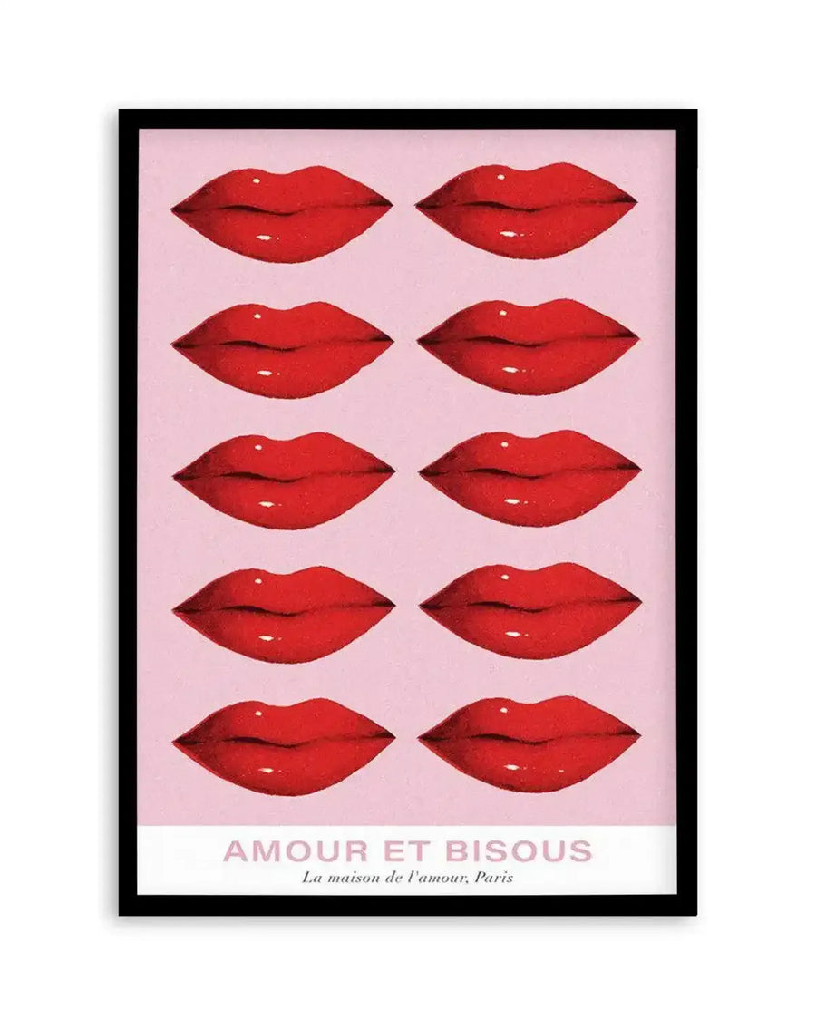 Art print featuring ten pairs of glossy red lips arranged in five rows of two on a pale pink background, with the text "AMOUR ET BISOUS" and "La maison de l'amour, Paris" at the bottom, displayed in a black frame with a white border.