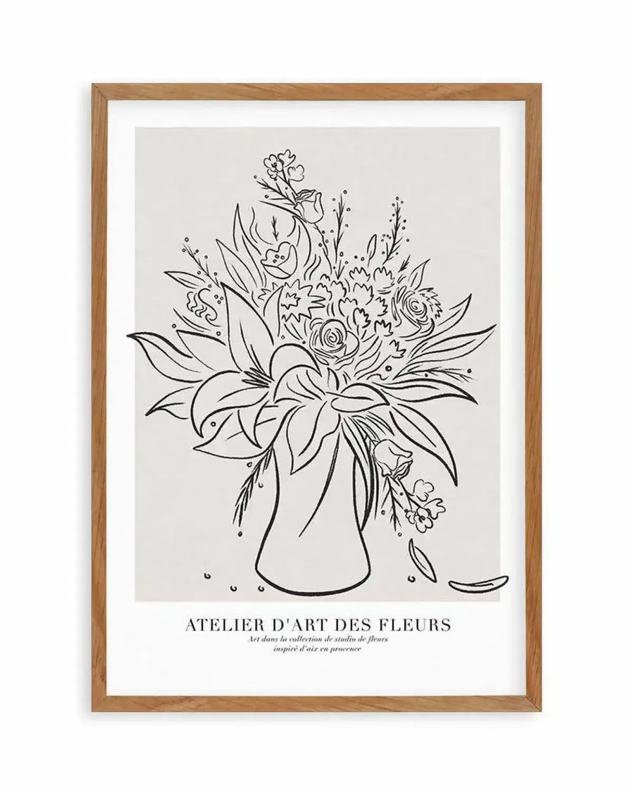"Line art print featuring a detailed bouquet of various flowers and foliage in a vase, drawn with thin black lines on a light cream background, displayed in a natural oak frame with white border. The bouquet includes roses, lilies, and other blossoms with scattered petals at the base."