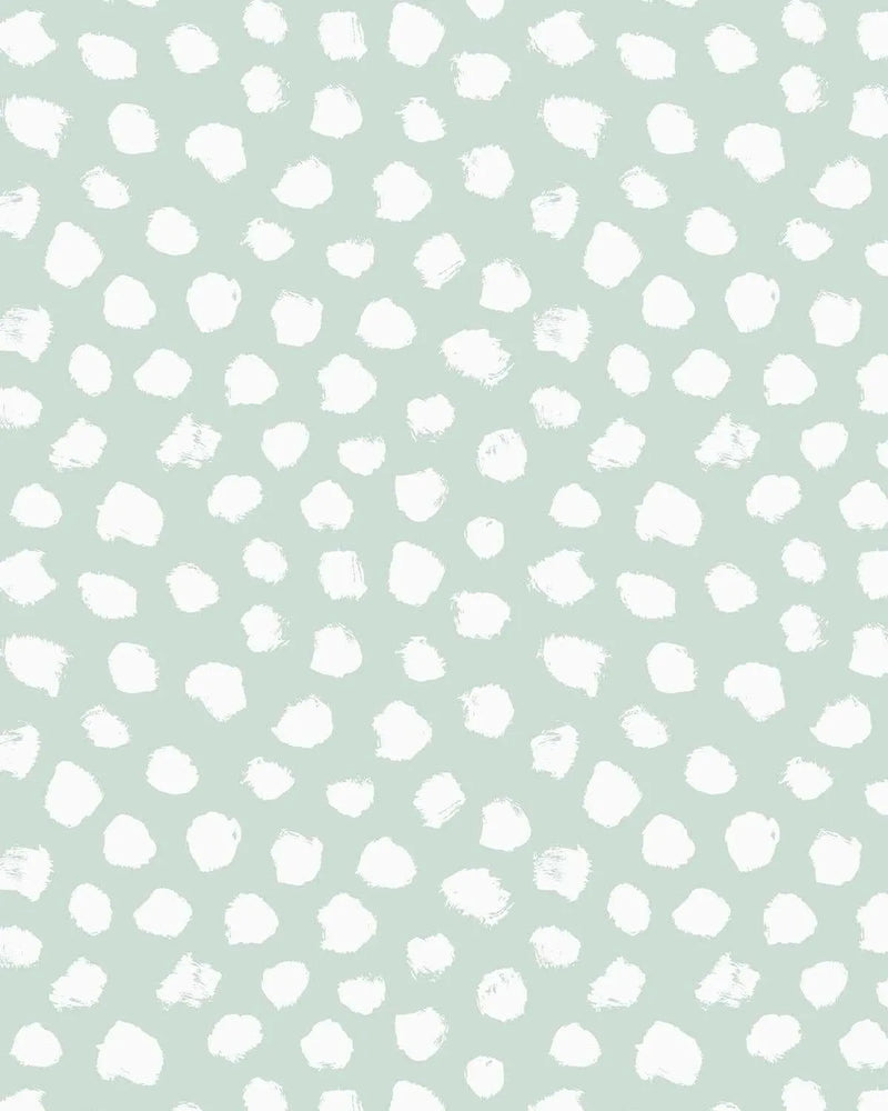 Bella's Dots Modern Mint Wallpaper features a repeating pattern of white hand-painted circular and organic brush stroke dots scattered across a soft sage green background. The dots vary in size and shape, some perfectly round and others with irregular, textured edges suggesting watercolor or acrylic paint application. The composition is evenly distributed across the surface, creating a calm, minimalist aesthetic with a contemporary feel.