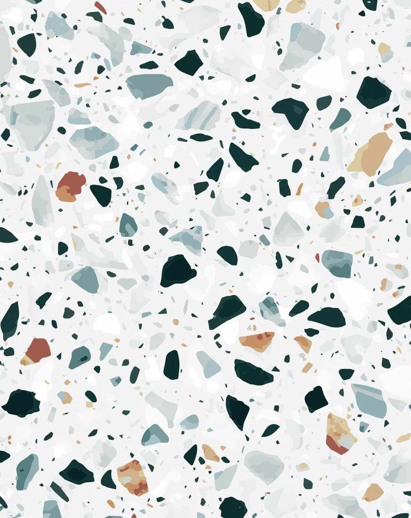 Peel and stick wallpaper featuring a repeating pattern of terrazzo stone in various shapes and sizes on a white background. The stone fragments are in shades of dark teal, pale blue-grey, warm beige, and terracotta, with smaller black flecks interspersed throughout.