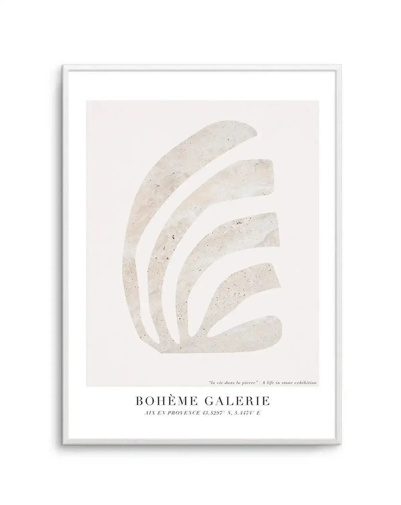 Abstract art print featuring five curved, organic shapes in a textured, light beige or off-white tone, resembling natural stone or concrete, against a plain cream background. The shapes are arranged in a fanned, overlapping pattern, creating a sense of movement and depth. The print is displayed in a white frame with a white border.