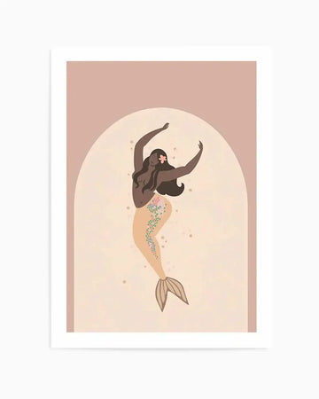 Illustration art print featuring a dark-skinned mermaid with long dark hair and a pink flower tucked behind her ear, dancing with arms raised. Her tail is a light peach colour with scattered pink, green, and yellow floral details and small brown speckles. The mermaid is set against a light cream arched background, framed by a soft blush pink border.