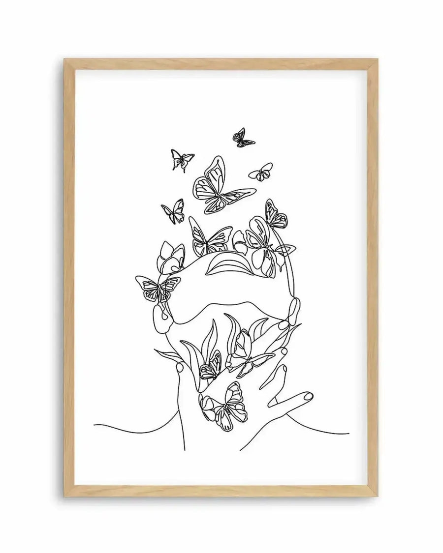 Line art print featuring a continuous black line drawing of a person's head and shoulders, with hands gently cupping their face, surrounded by numerous butterflies and delicate leaves, displayed in a natural wood frame with white border.