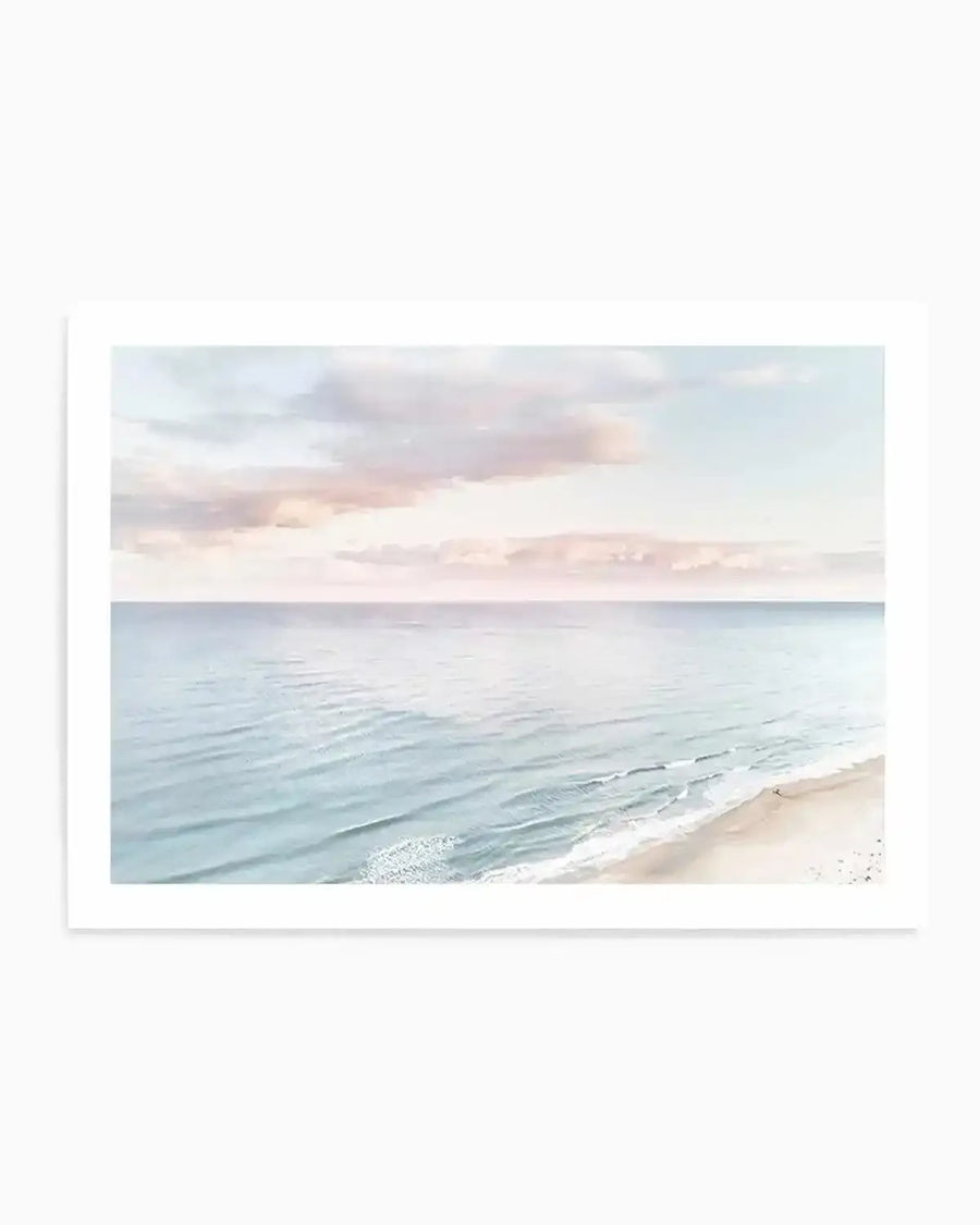 Pastel coastal seascape print, unframed with white border — soft blue ocean and sandy shore