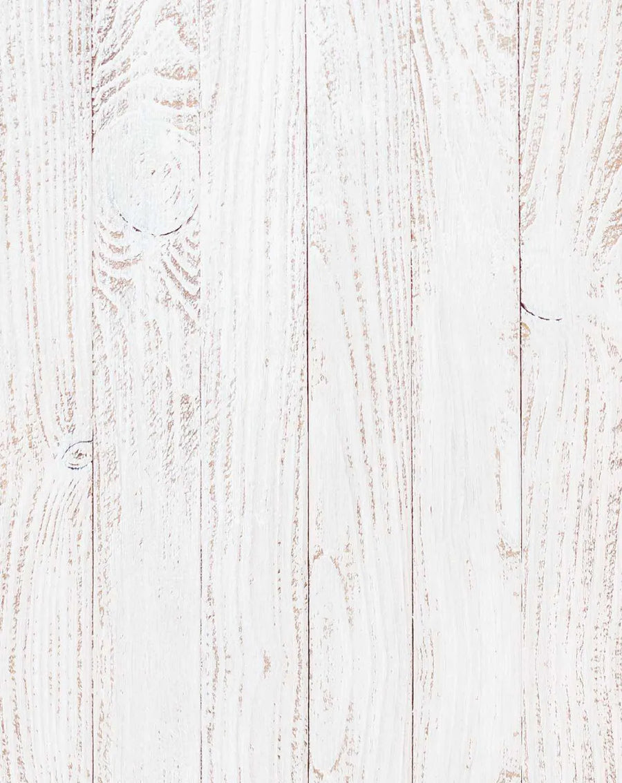 Peel and stick wallpaper featuring a repeating pattern of vertical whitewashed wood panels with visible grain and knot details in subtle shades of off-white and pale cream. The design has a rustic, distressed texture with hints of natural wood showing through the paint.