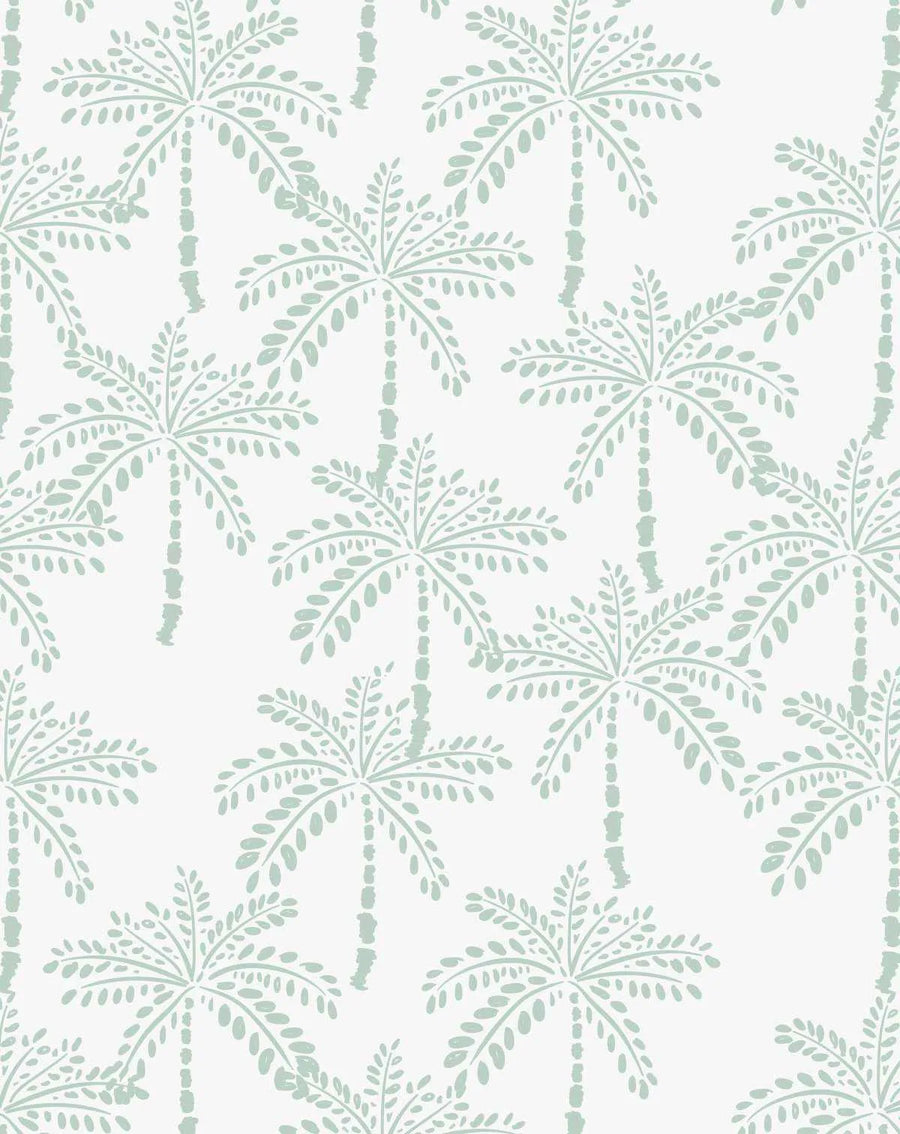 Peel and stick wallpaper featuring a repeating pattern of hand-drawn palm trees in a muted mint green on a crisp white background. The design has a loose, organic quality with visible brushstroke texture, depicting palm fronds and textured trunks.