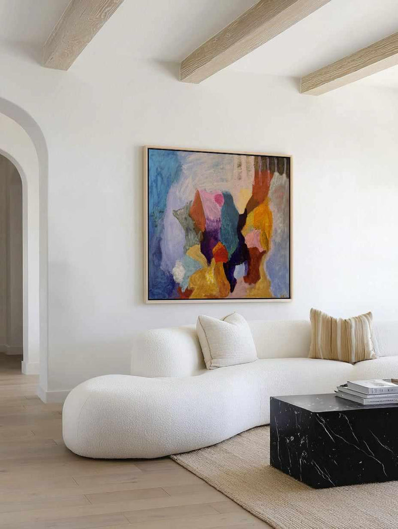 Modern living room with a white sofa, abstract painting, and marble coffee table. Developing Is Key by Svend Kindt-Larsen | Framed Canvas Art Print from Olive et Oriel