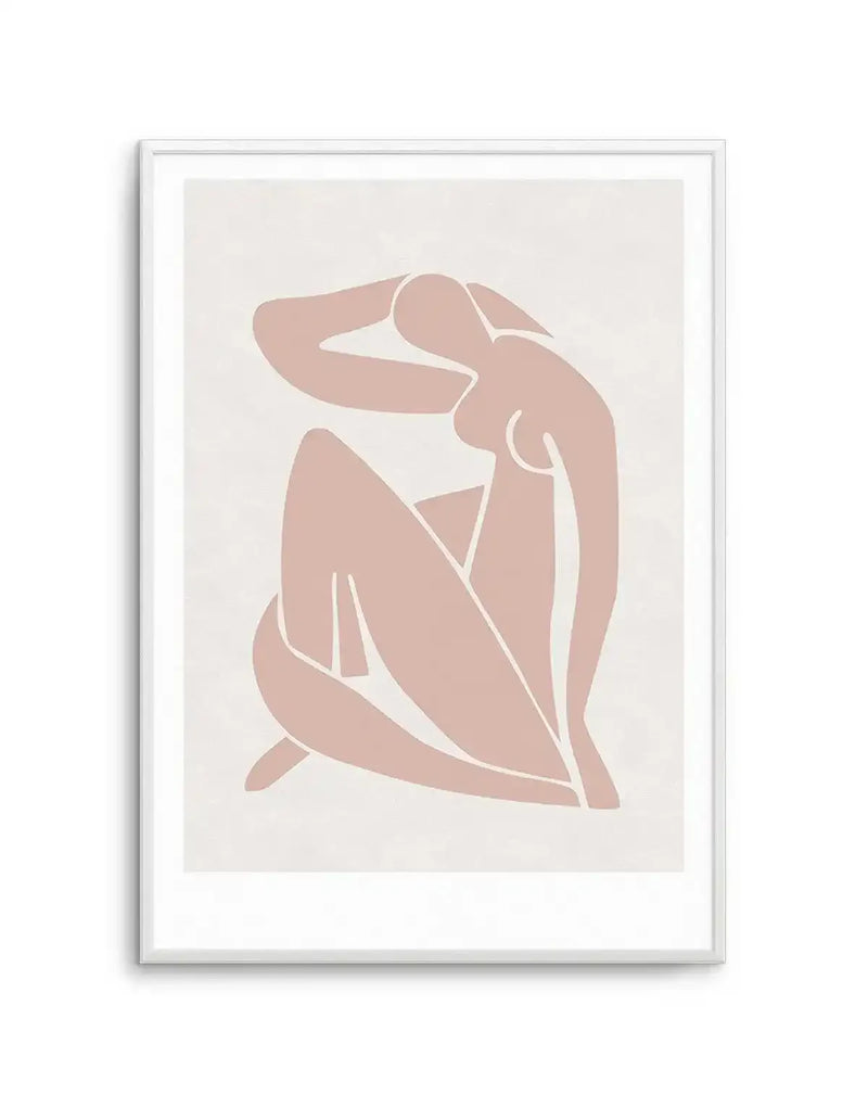 Decoupes Femme art print featuring a simplified, abstract illustration of a seated female nude in a warm, dusty rose hue against a soft cream background. The figure is rendered with smooth, organic shapes and clean white outlines, with her head tilted back and arms raised, one hand resting on her head. The print is displayed in a white frame with a white border.