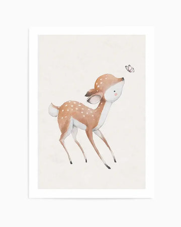 Watercolour art print featuring a baby deer with light brown fur and white spots, looking up at a small white butterfly with pink accents. The deer has large, innocent eyes and a soft pink blush on its cheeks. The background is a plain, light cream colour, giving the illustration a gentle and whimsical mood.