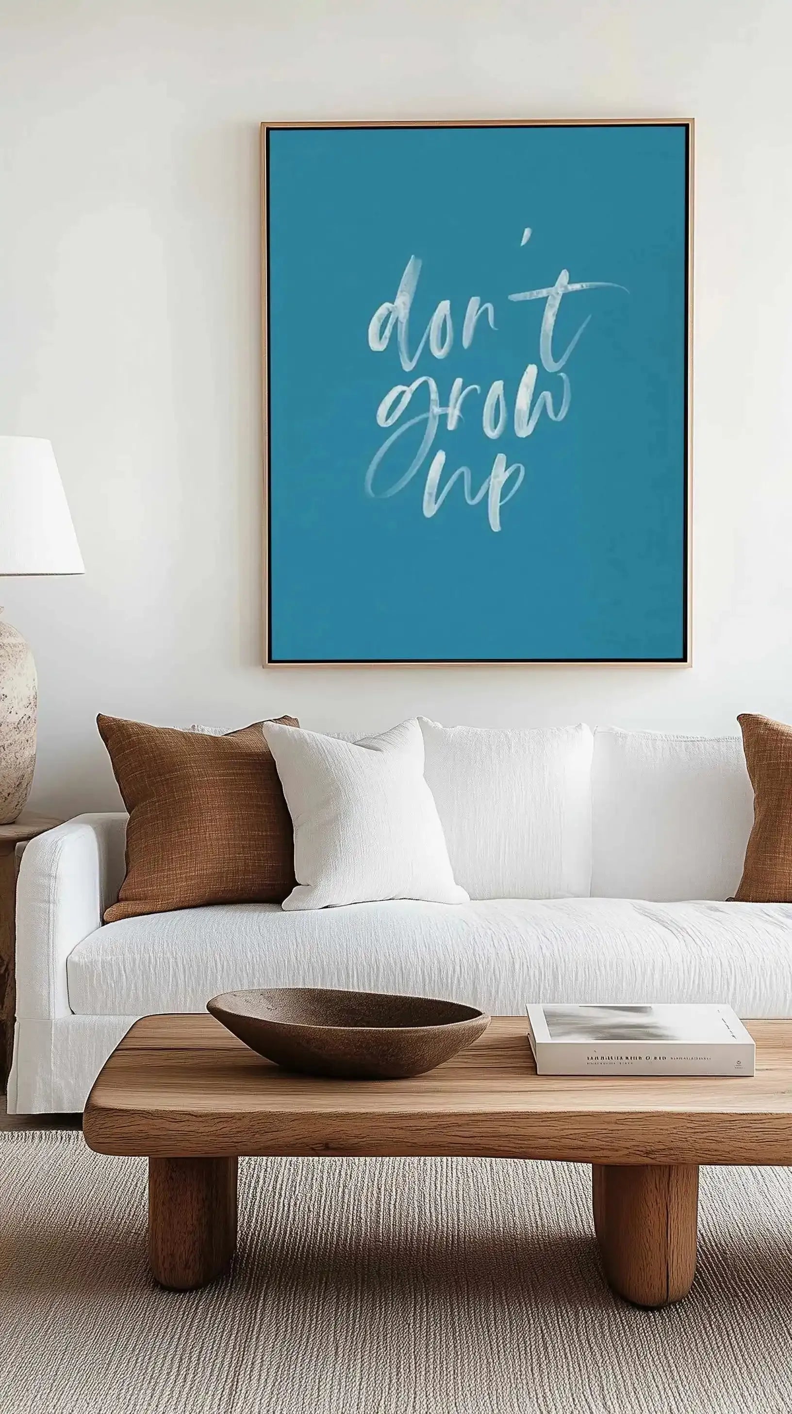 Don't Grow Up | Ocean Blue | Framed Canvas Art Print from Olive et Oriel where you can shop wallpaper and artworks online