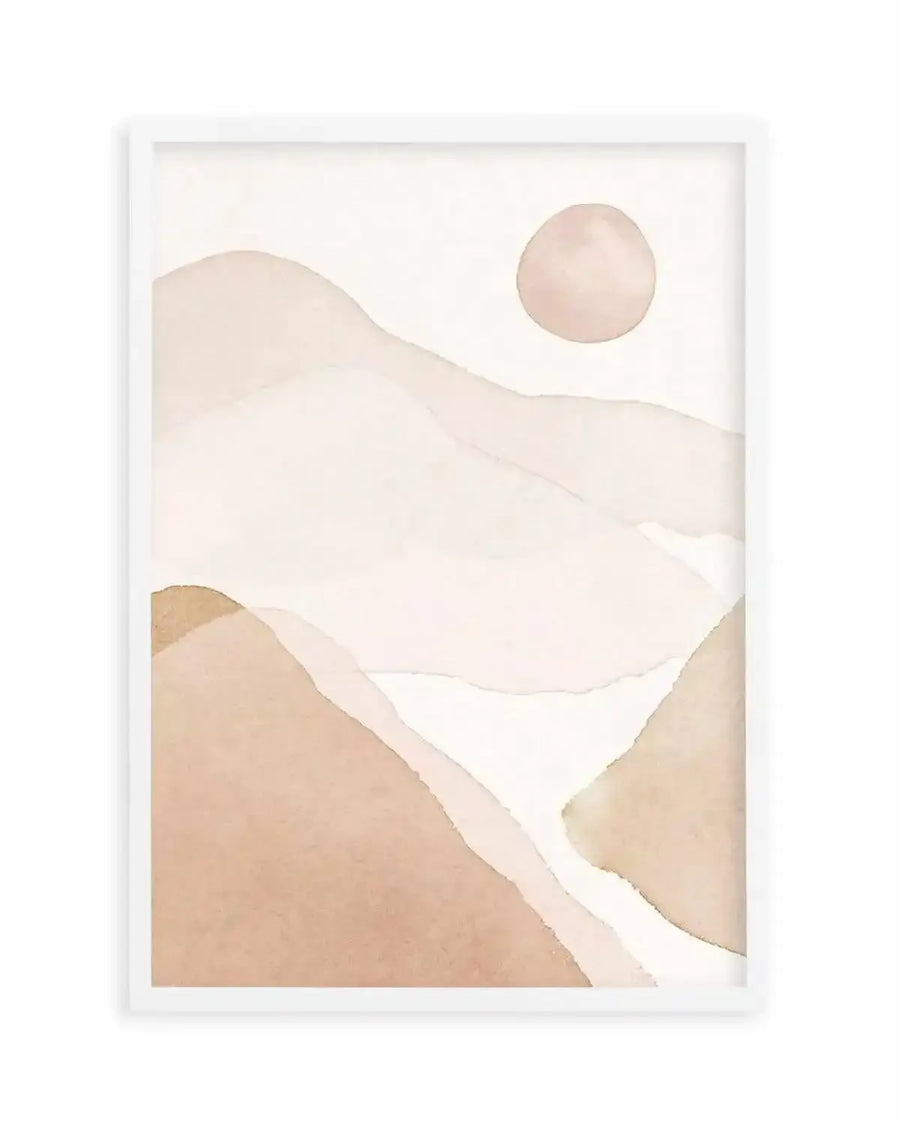 Abstract art print featuring soft, undulating shapes in muted tones of blush pink, warm beige, and cream, suggestive of rolling hills or a desert landscape under a pale sun. The watercolour-style composition has a gentle, ethereal quality with visible brushstroke texture, displayed in a white frame with a white border.