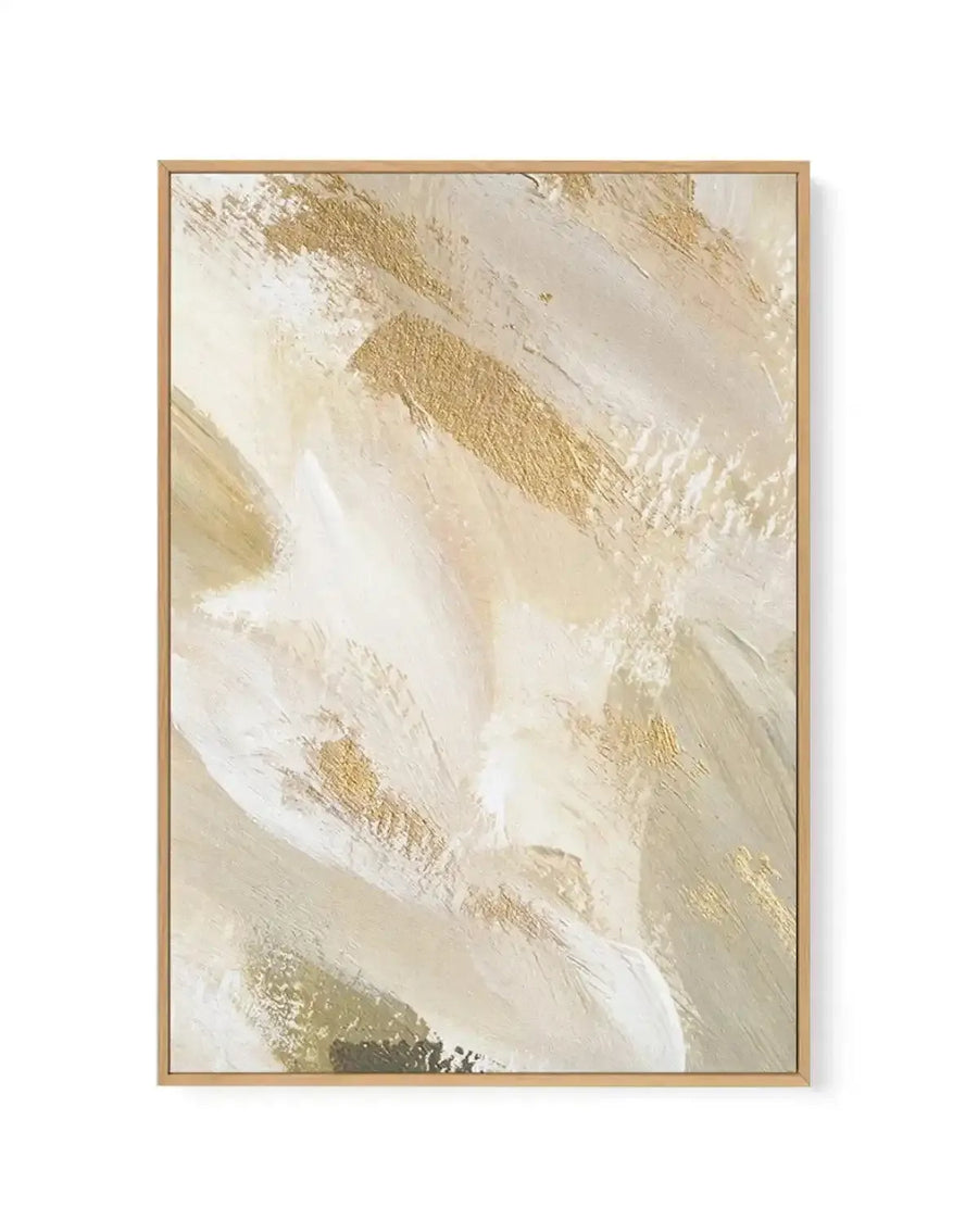Framed canvas art print titled Eclosque I featuring an abstract composition of diagonal brushstrokes in cream, white, and warm gold tones. The painting has a textured, layered appearance with visible brushwork creating movement across the canvas. A natural wood frame with a light tan finish surrounds the artwork, which is mounted with a white border.