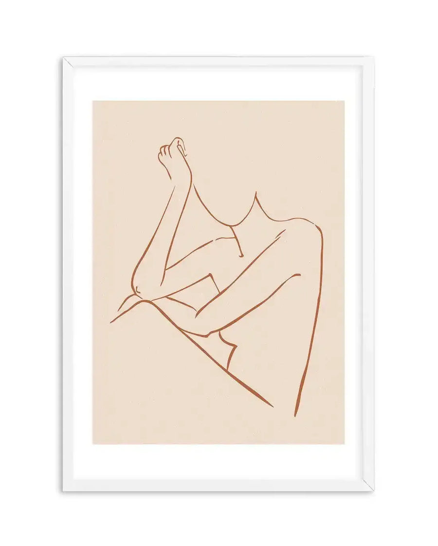 Line art print featuring a minimalist female form in a relaxed pose, with a single continuous terracotta line on a warm cream background, displayed in a white frame with white border.