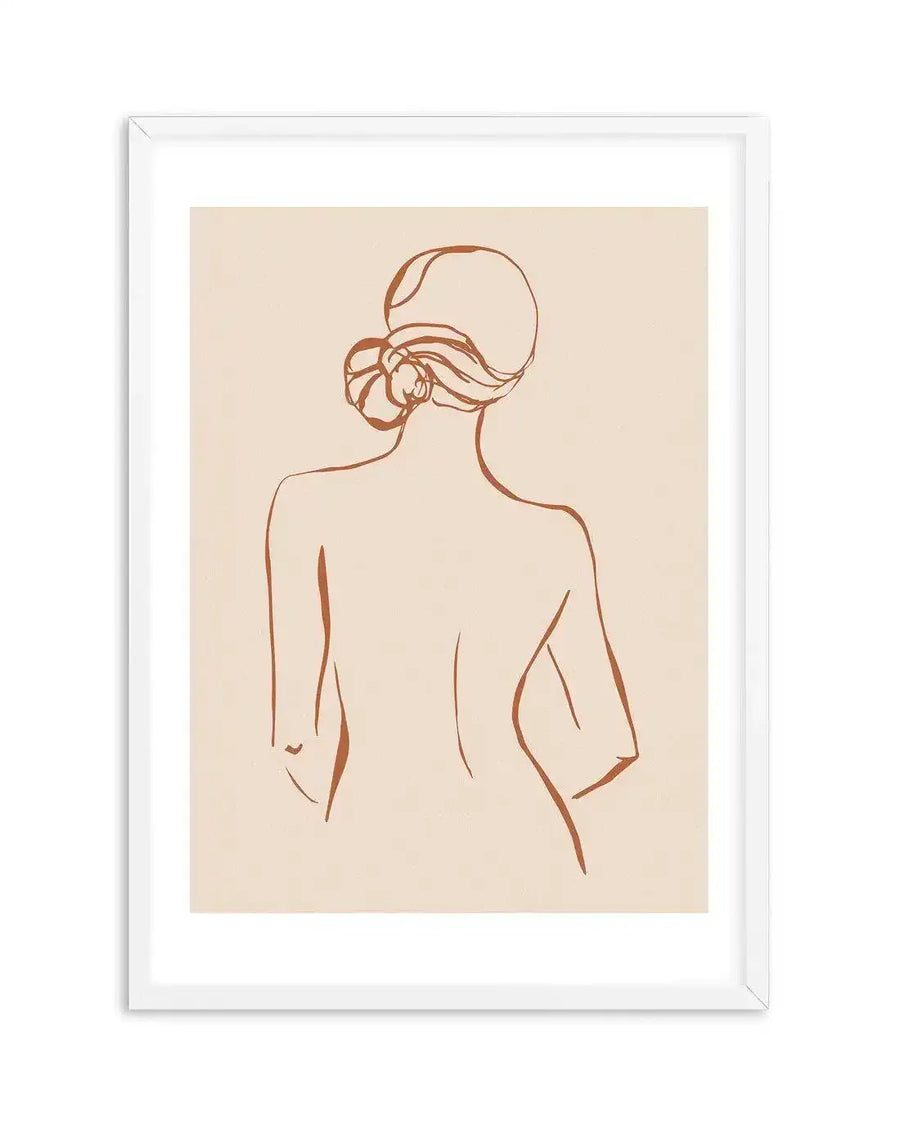 Line art print featuring a female form viewed from the back, with a simple, continuous terracotta-coloured line drawing on a warm cream background. The figure has hair styled in a loose bun and is displayed in a white frame with a white border.