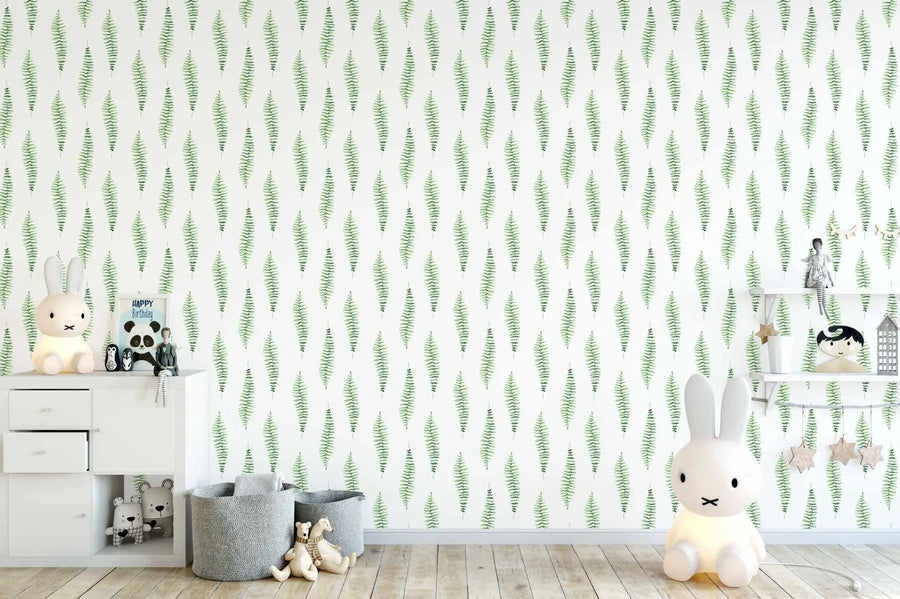Nursery:
"Peel and stick wallpaper featuring a repeating pattern of hand-painted fern foliage in vibrant emerald green with visible brushstroke texture on a crisp white background, displayed in a child's nursery. The room includes a white dresser, a white bunny lamp, and various toys."