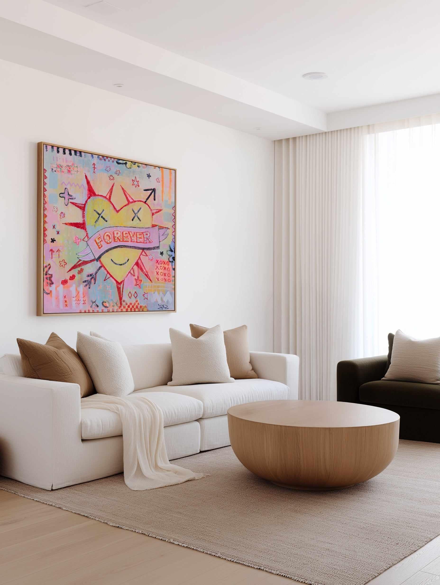 Modern living room with a colorful vibrant Jackie Green abstract painting on the wall, white sofa, and wooden coffee table.