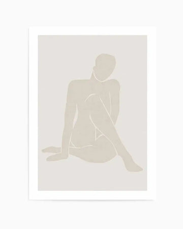 Minimalist beige art print featuring an abstract female figure in a seated pose against a light gray background. The figure is rendered in soft, muted beige tones with white line details defining the contours of the body, shoulders, and facial profile. The composition uses negative space and subtle gradations to create a contemplative, serene mood. The artwork is displayed in a white frame with white border, shown against a neutral background.