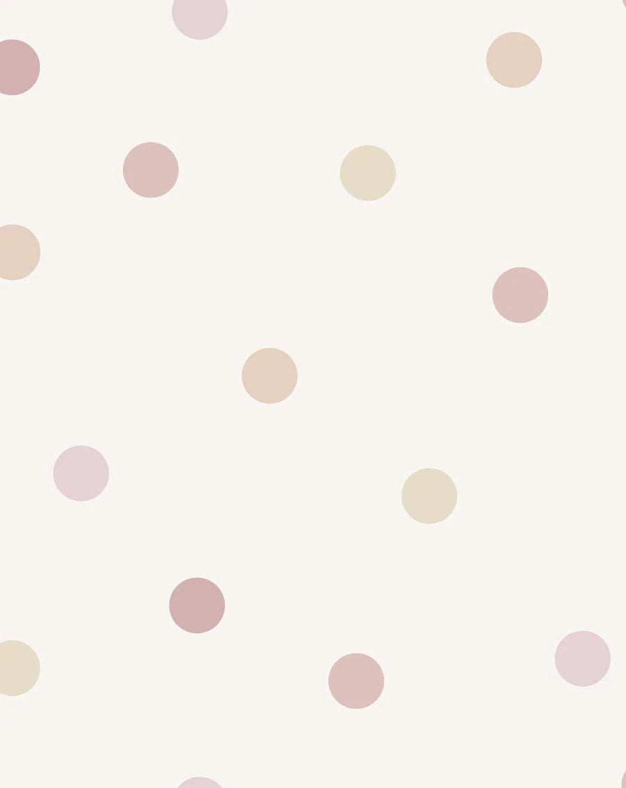 Peel and stick wallpaper featuring a repeating pattern of evenly spaced polka dots in varying shades of soft pink, dusty rose, and pale beige on a creamy white background. The dots have a smooth, matte finish.