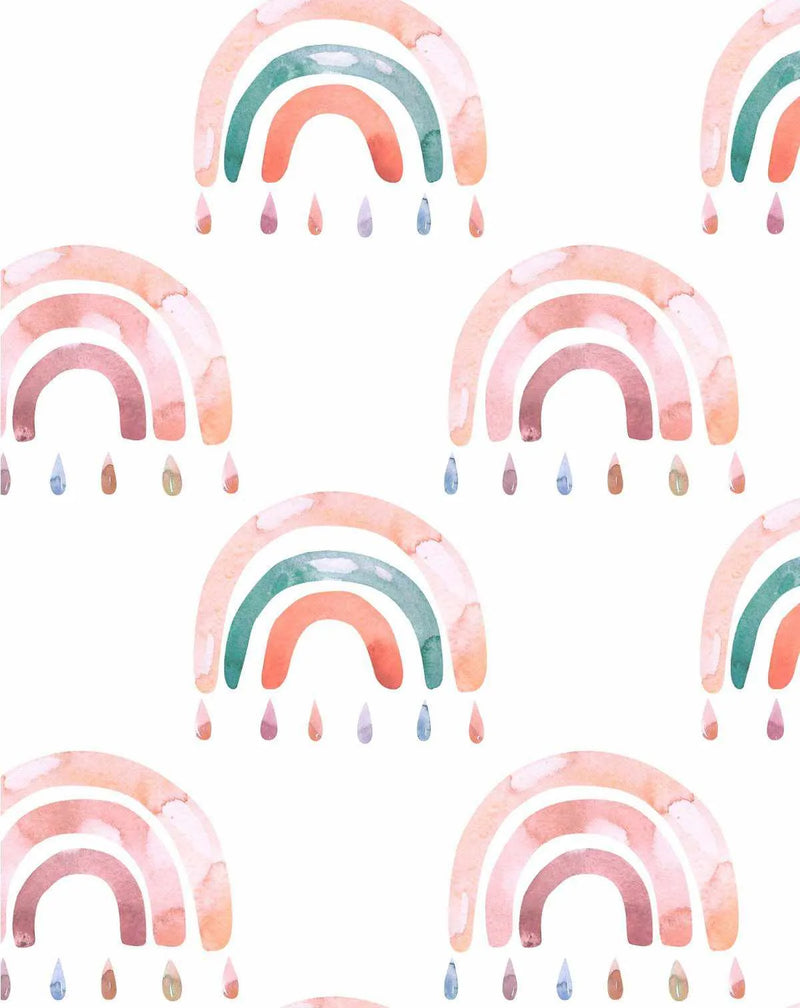 Peel and stick wallpaper featuring a repeating pattern of hand-painted rainbows in soft watercolour hues of peach, coral, and teal green, with individual raindrops in muted pink, blue, and brown tones falling from each rainbow on a clean white background.