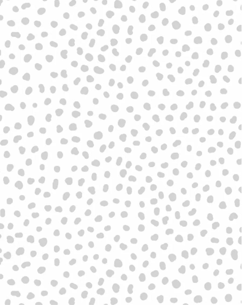 Peel and stick wallpaper featuring a repeating pattern of irregular, hand-drawn dots in a soft, light grey on a clean white background. The design has a playful, organic quality with a subtle, matte finish.