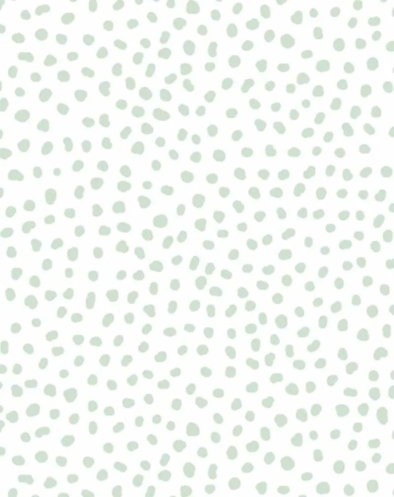 Peel and stick wallpaper featuring a repeating pattern of irregular, hand-drawn dots in a soft sage green on a clean white background. The dots vary slightly in size and shape, giving the design a playful, organic, and minimalist quality.