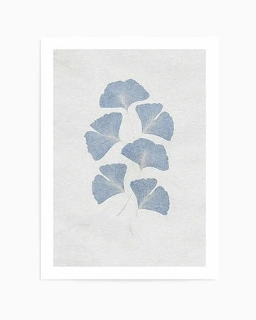 Art print featuring a vertical arrangement of seven ginkgo leaves in a soft, muted blue against a textured, off-white background. The leaves have a fan-like shape with delicate vein details, giving them a subtle, hand-drawn quality.