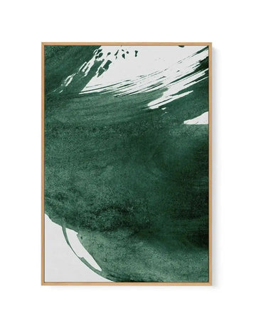 Framed canvas art print featuring abstract paint splashes in shades of forest green, sage green, and white. The composition shows dynamic brushstrokes and organic shapes concentrated in the upper right and lower left corners, with textured, watercolor-like application against a light background. Natural wood-toned frame with white border surrounding the artwork.
