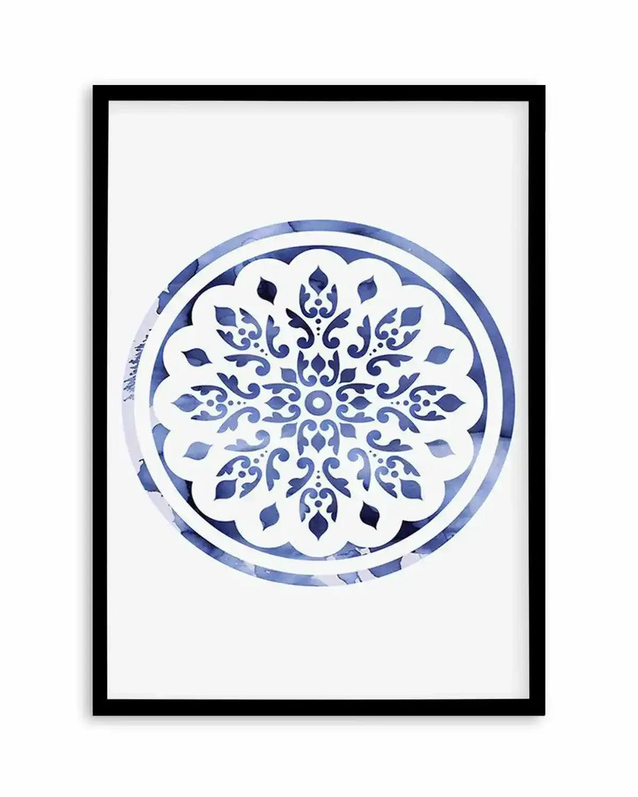 Watercolour art print featuring a circular mandala design in varying shades of blue, with intricate floral and scrollwork patterns on a white background, displayed in a black frame with white border.