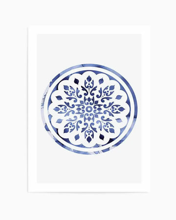 Watercolour art print featuring a circular mandala design with intricate floral and scrollwork patterns in varying shades of blue, from deep indigo to pale sky blue, on a white background. The design is contained within a circular border with a textured, watercolor-wash effect.