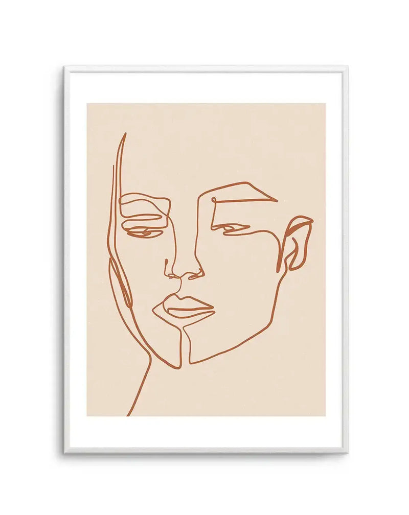 Line art print featuring a minimalist illustration of a woman's face in terracotta brown on a light beige background, with a white frame and white border. The continuous line drawing depicts the woman's profile with subtle facial features and a contemplative expression.