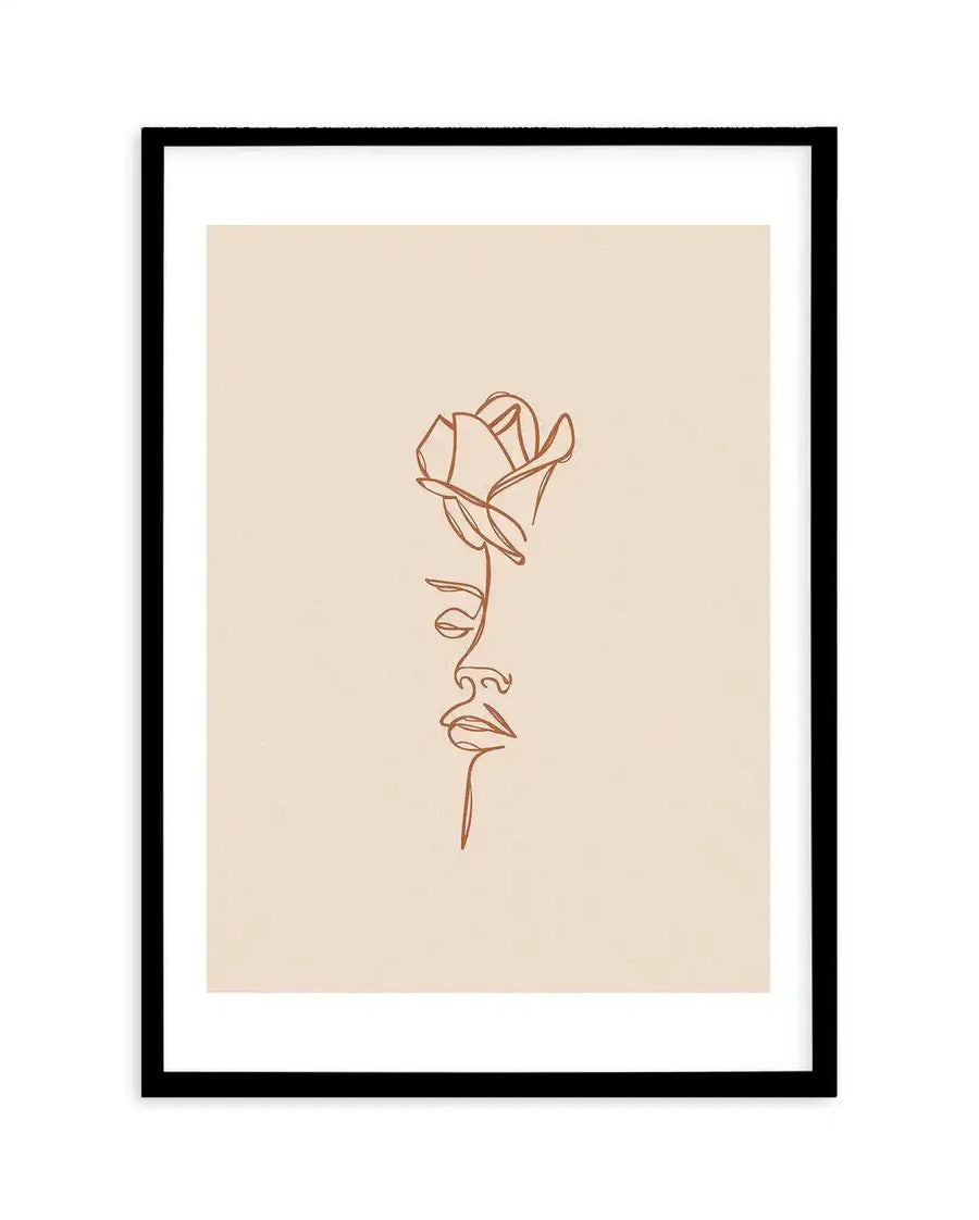 Line art print featuring a single continuous terracotta-colored line forming the profile of a woman's face from the nose down, with a rose blooming from her forehead, displayed in a black frame with a white border.