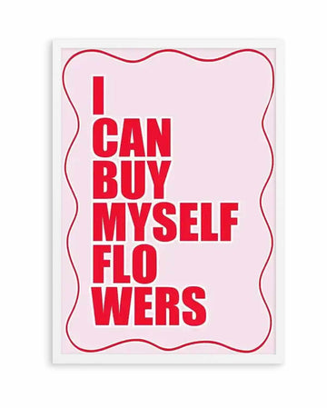 Art print with bold red text reading "I CAN BUY MYSELF FLOWERS" centered on a soft pink background. The text is arranged in five lines in a modern, sans-serif typeface. A decorative red wavy border frames the entire design. The print is mounted in a white frame with a white border.