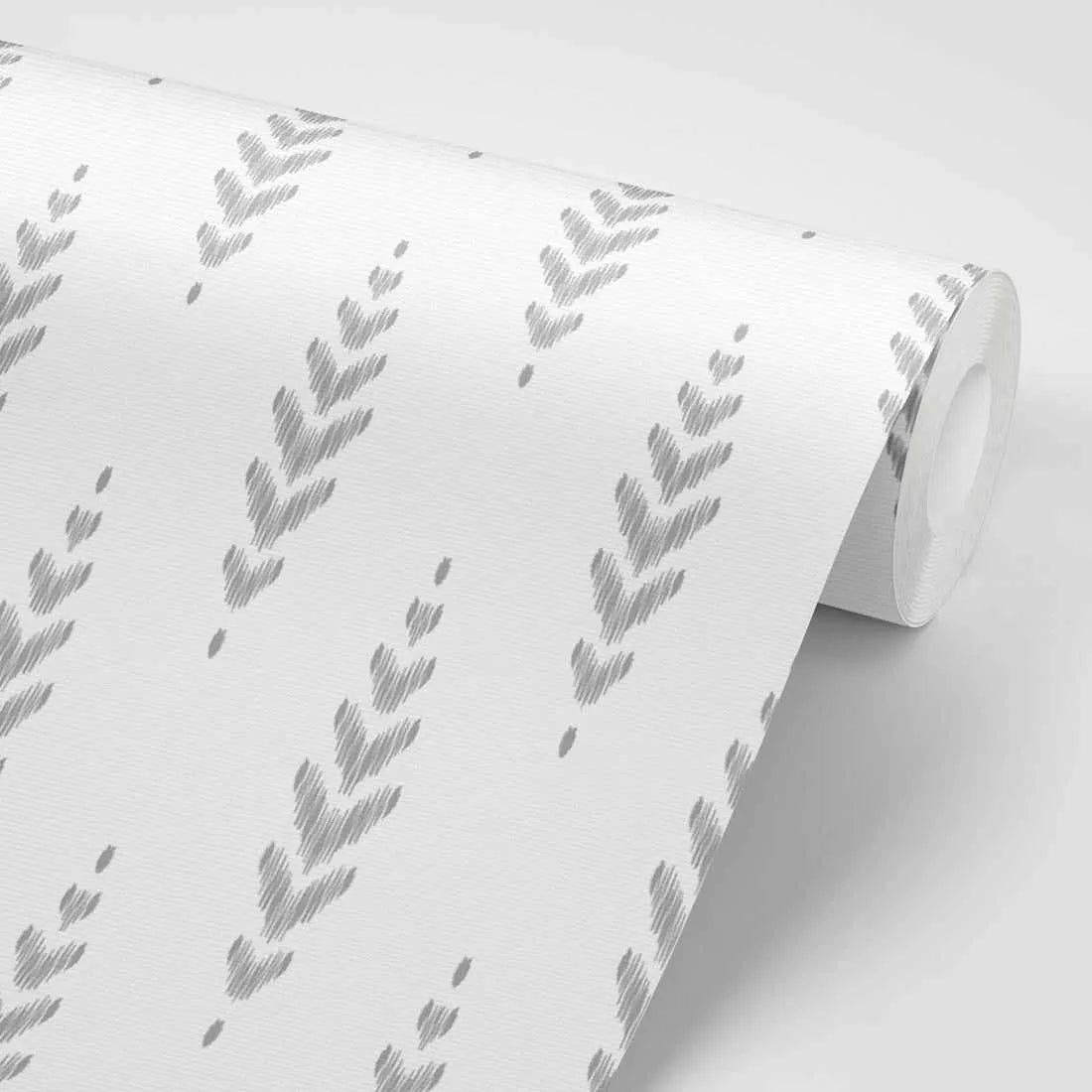 Peel and stick wallpaper featuring a repeating pattern of abstract, hand-drawn chevron or arrow shapes in a textured light grey on a clean white background. The design has a slightly distressed, sketched quality with visible line work and a subtle woven texture on the paper.